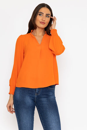 Carraig Donn Long Sleeve Collarless Top in Orange