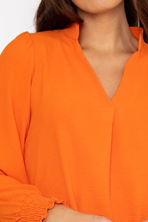Carraig Donn Long Sleeve Collarless Top in Orange